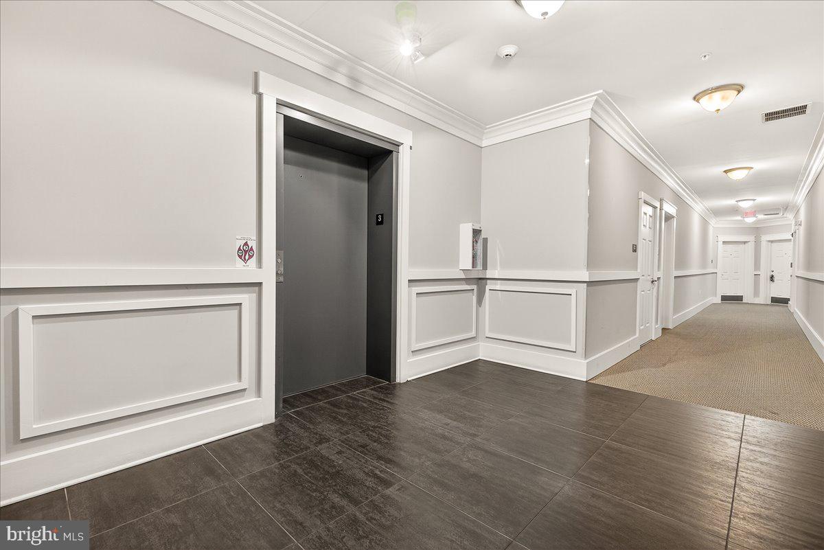 3911 Doc Berlin Drive, Unit 37 Silver Spring, MD 20906 - Photo 5 of 35 a view of wooden floor and windows in a room