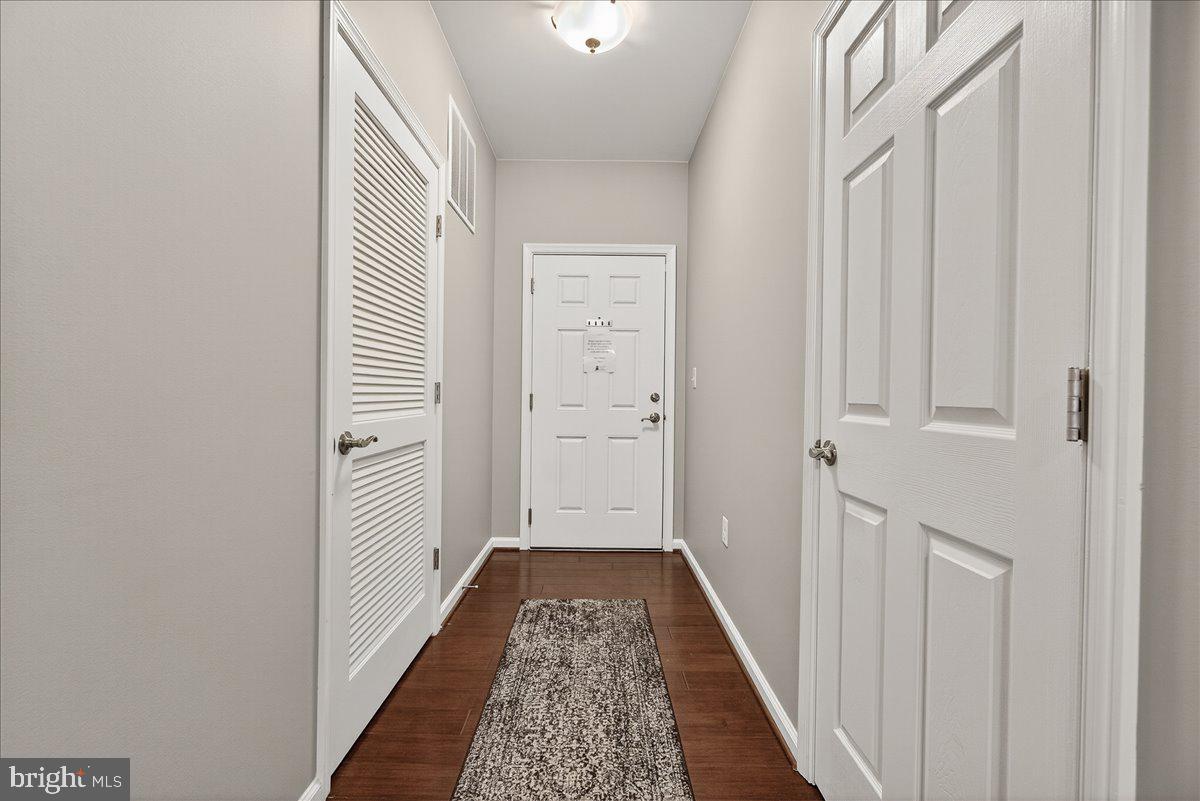 3911 Doc Berlin Drive, Unit 37 Silver Spring, MD 20906 - Photo 7 of 35 a view of a hallway with wooden floor and entryway
