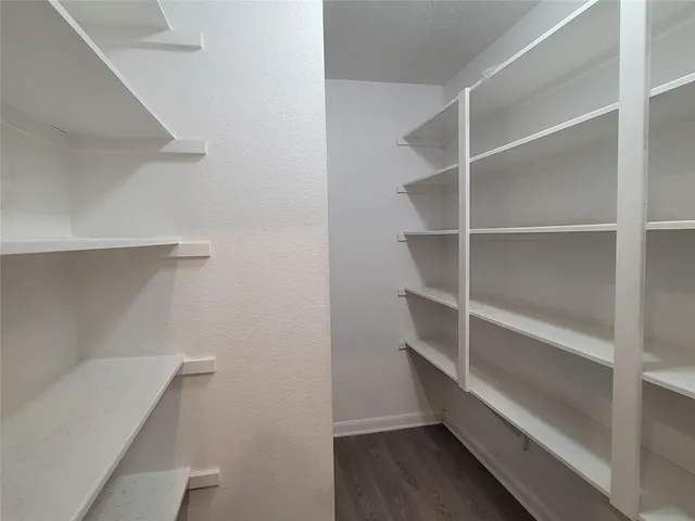 a view of an empty walk in closet