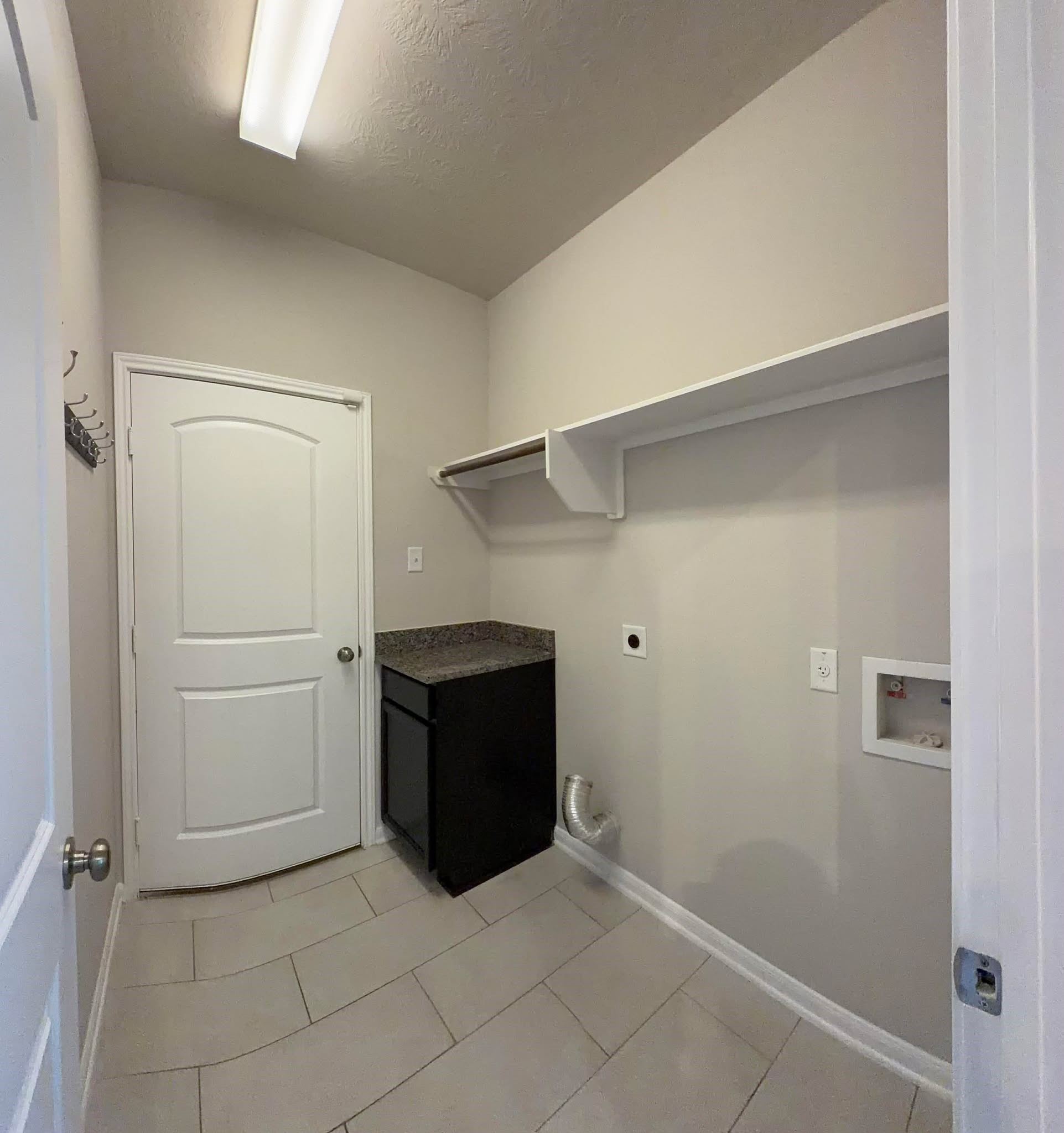 1841 Basin Trail Brenham, TX 77833 - Photo 14 of 49 Laundry next to the pantry