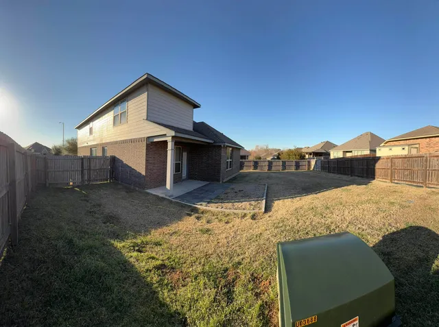 a house view with a outdoor space