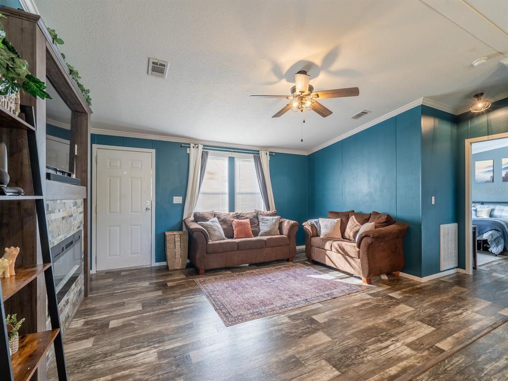 22457 Northeast 130th Court Road Fort McCoy, FL 32134 - Photo 16 of 43 a living room with furniture and a window