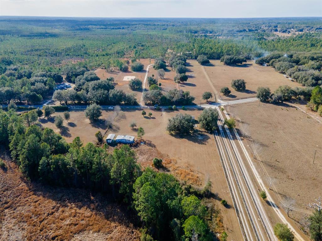 22457 Northeast 130th Court Road Fort McCoy, FL 32134 - Photo 3 of 43 a view of lake and mountain view