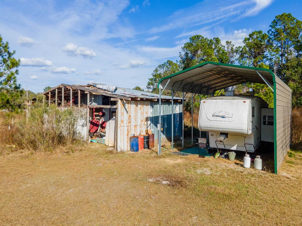 22457 Northeast 130th Court Road Fort McCoy, FL 32134 - Photo 35 of 43 a view of a street with a car park