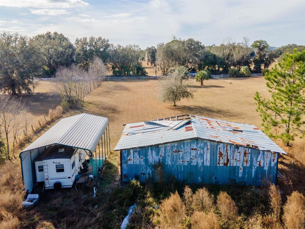 22457 Northeast 130th Court Road Fort McCoy, FL 32134 - Photo 38 of 43 a backyard of a house with lots of green space and lake view