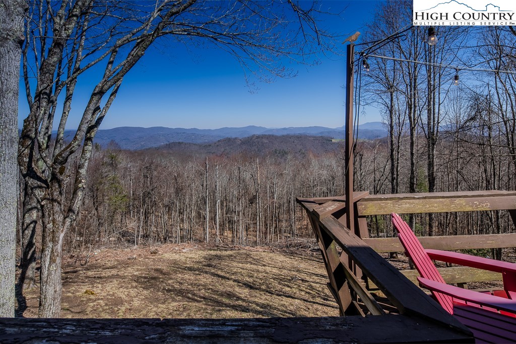 808 Pine Ridge Road Beech Mountain, NC 28604 - Photo 29 of 33 a view of a roof deck with furniture and a yard