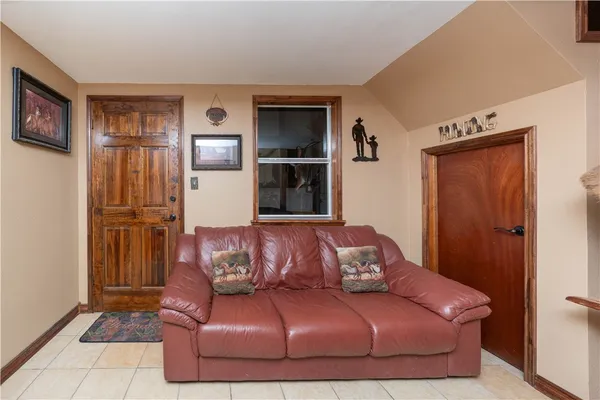 a living room with a couch and a cabinet