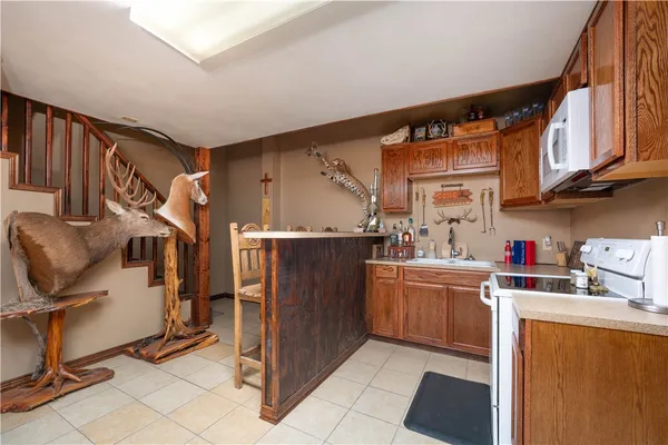 a kitchen with refrigerator and cabinets