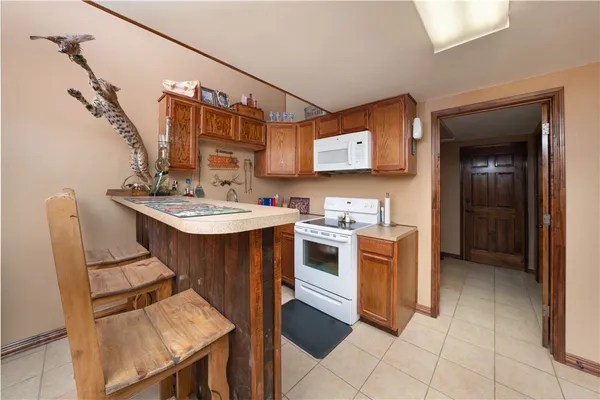 a kitchen with a sink appliances and cabinets