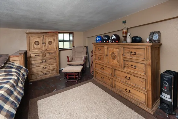 a bed room with a bed and a dresser