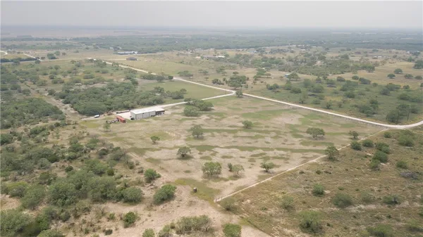 a roof deck with table and chairs