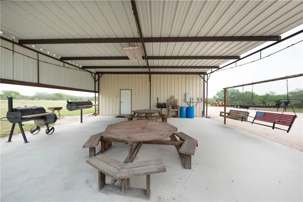 a bedroom with furniture and a rug