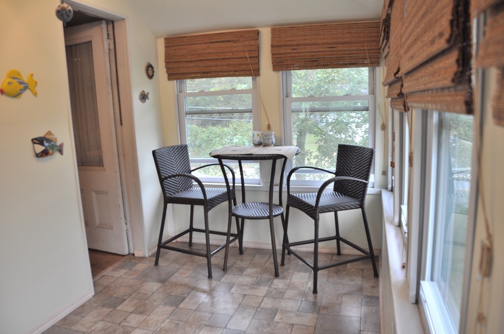 86 Spring Street, Unit B Stoneham, MA 02180 - Photo 12 of 17 a view of a dining room with furniture and a window