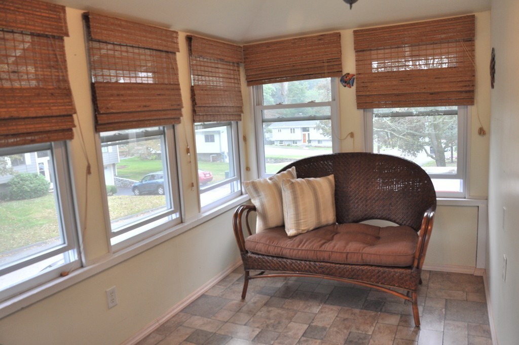 86 Spring Street, Unit B Stoneham, MA 02180 - Photo 13 of 17 a living room with furniture and a large window