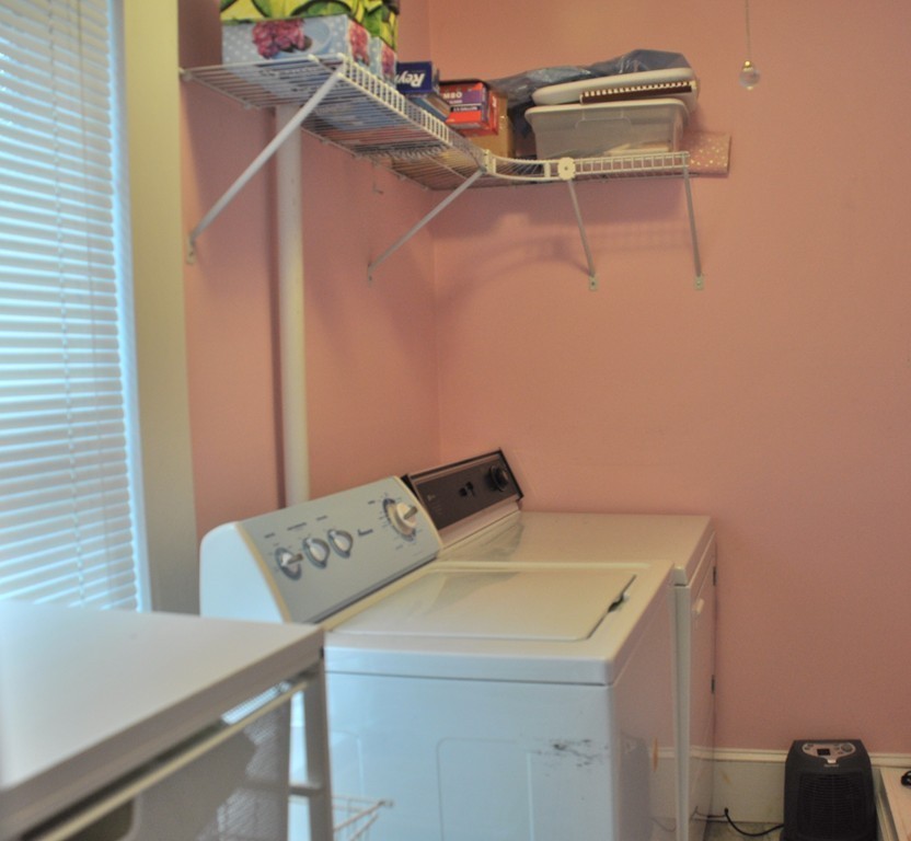 86 Spring Street, Unit B Stoneham, MA 02180 - Photo 15 of 17 a utility room with dryer and washer