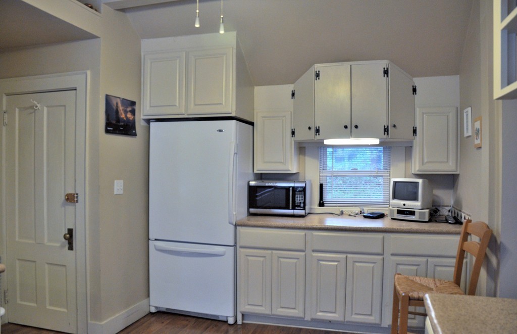 86 Spring Street, Unit B Stoneham, MA 02180 - Photo 5 of 17 a white refrigerator freezer sitting inside of a kitchen