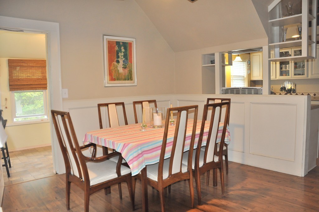 86 Spring Street, Unit B Stoneham, MA 02180 - Photo 6 of 17 a view of a dining room with furniture and wooden floor