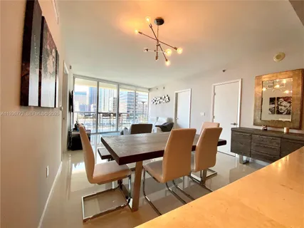 a view of a dining room with furniture