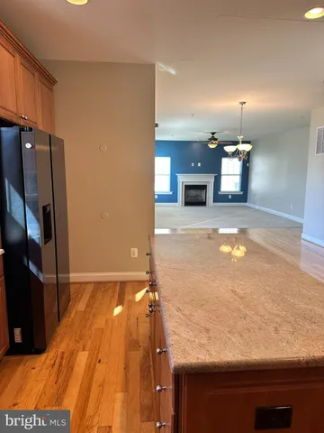 a view of empty room with a fireplace