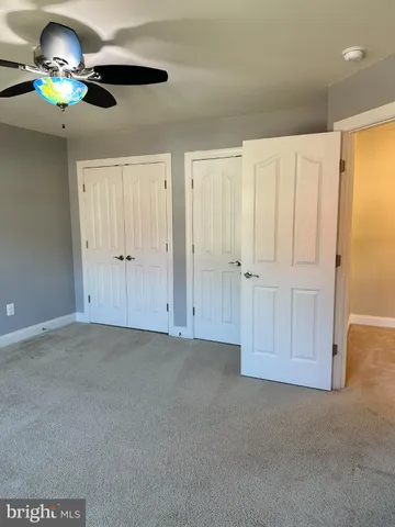 a view of a hallway with seating area