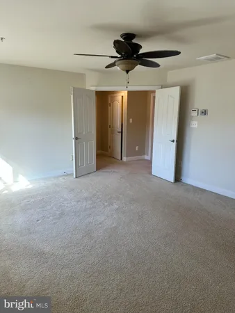 a bathroom with a tub sink shower and mirror