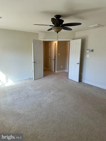 a bathroom with a tub sink shower and mirror