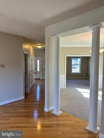 a large kitchen with stainless steel appliances granite countertop a stove a refrigerator a sink and a oven