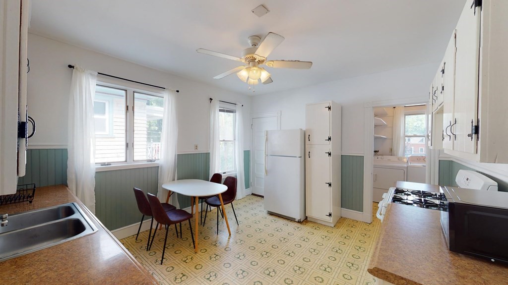 30 Roseclair Street, Unit 2 Boston, MA 02125 - Photo 5 of 14 a view of a livingroom with furniture and a dining table
