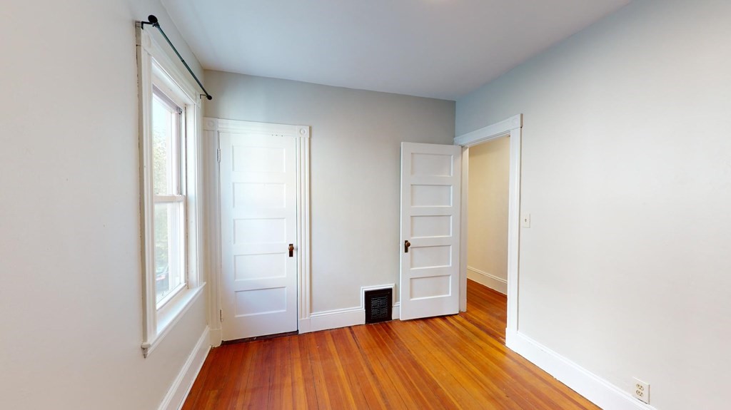 30 Roseclair Street, Unit 2 Boston, MA 02125 - Photo 8 of 14 a view of a room with wooden floor and a window