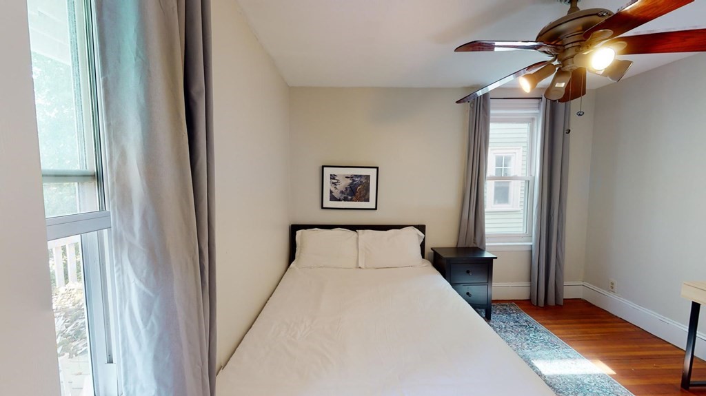 30 Roseclair Street, Unit 2 Boston, MA 02125 - Photo 10 of 14 a bedroom with a bed and a window