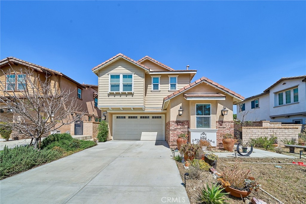 11568 Lark Drive Rancho Cucamonga, CA 91701 - Photo 1 of 20 a front view of a house with a yard