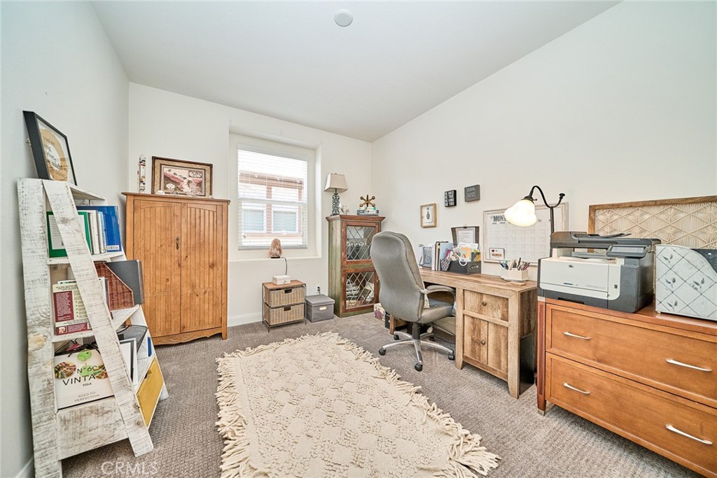 11568 Lark Drive Rancho Cucamonga, CA 91701 - Photo 17 of 20 a view of a workspace with furniture and a window