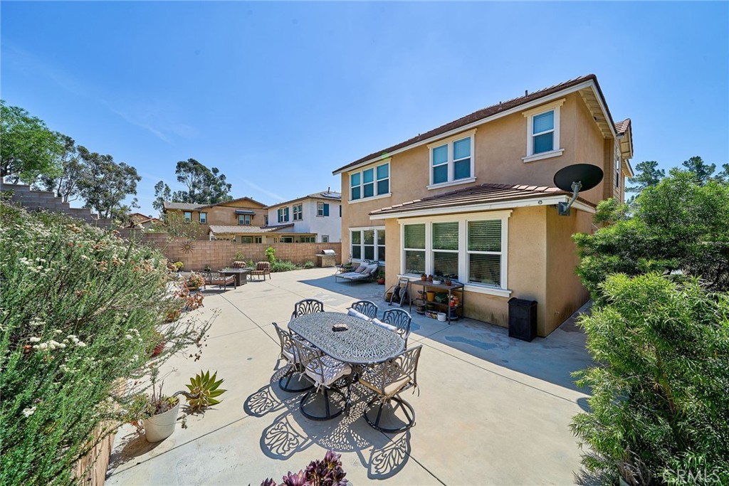 11568 Lark Drive Rancho Cucamonga, CA 91701 - Photo 18 of 20 a backyard of a house with table and chairs