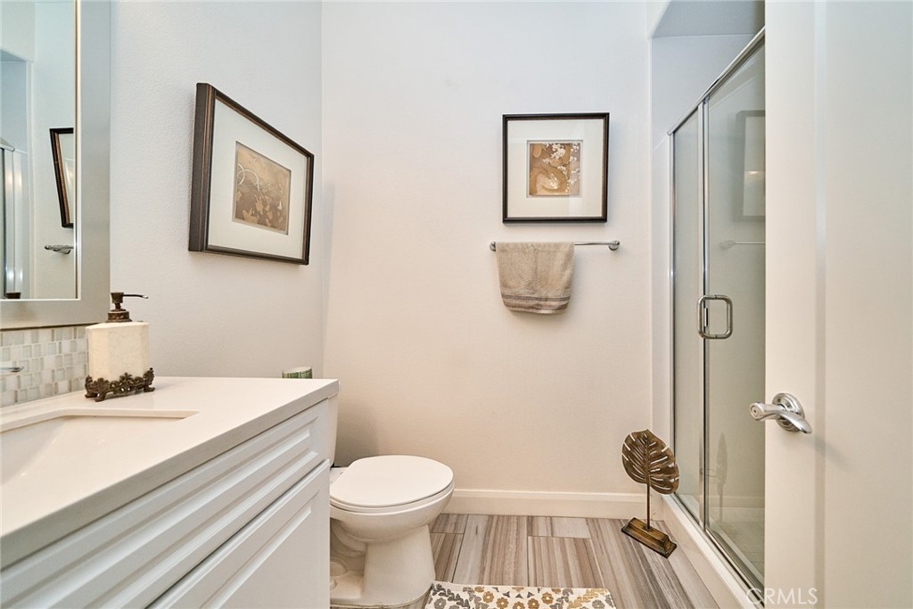 11568 Lark Drive Rancho Cucamonga, CA 91701 - Photo 7 of 20 a bathroom with a sink and a mirror