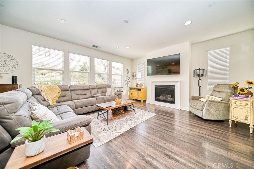 11568 Lark Drive Rancho Cucamonga, CA 91701 - Photo 8 of 20 a living room with furniture fireplace and flat screen tv