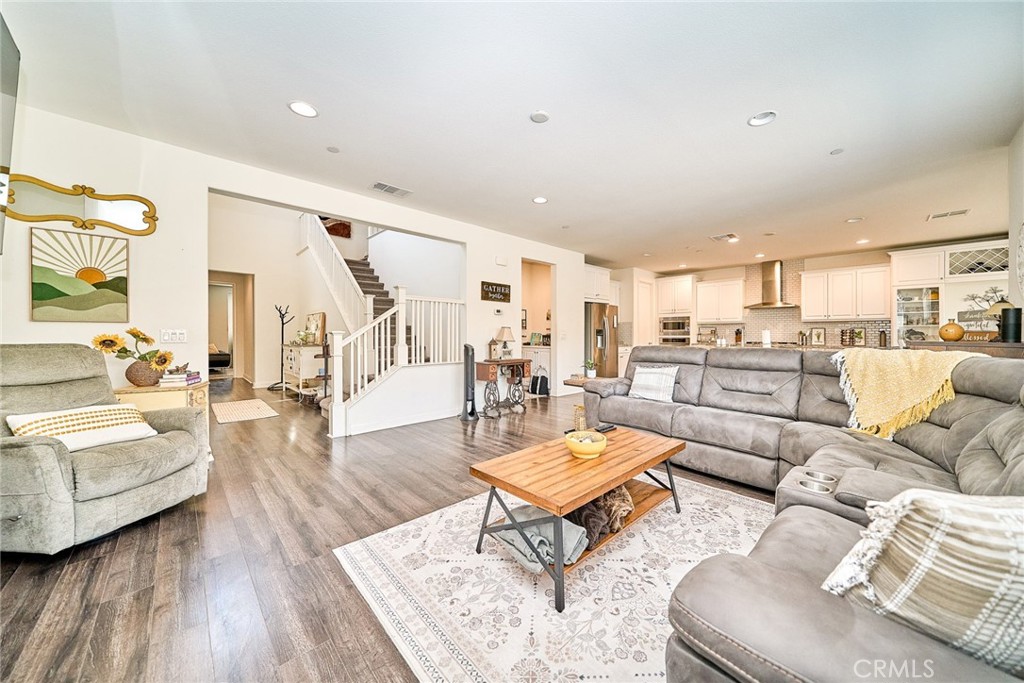 11568 Lark Drive Rancho Cucamonga, CA 91701 - Photo 9 of 20 a living room with furniture and view of kitchen