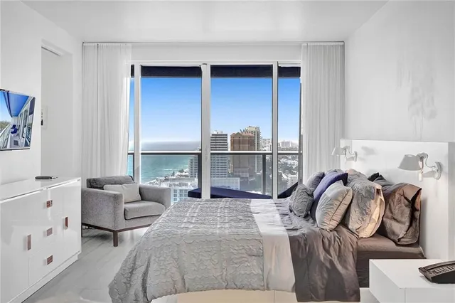 a view of living room with furniture and wooden floor