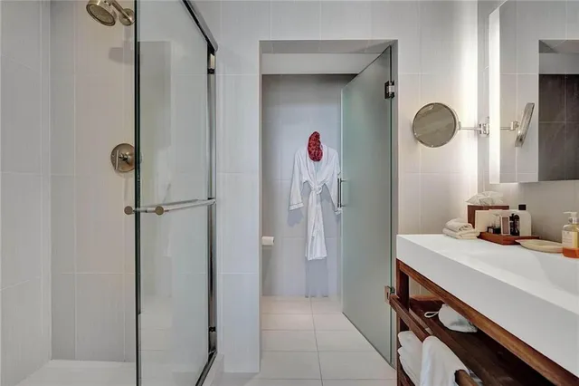 a kitchen with stainless steel appliances granite countertop a refrigerator and wooden cabinets