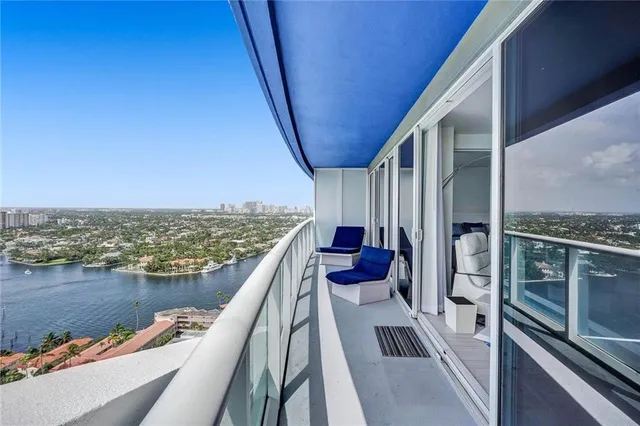 a bedroom with furniture and a flat screen tv