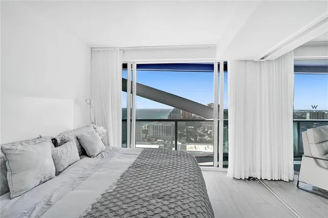 a view of a balcony next to a yard