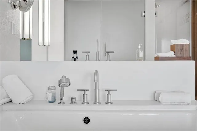 a kitchen with stainless steel appliances a sink and a refrigerator