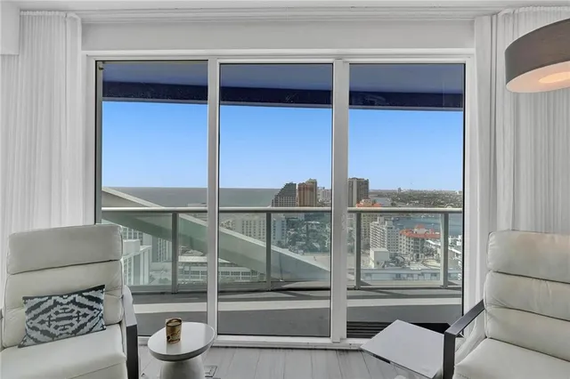 a balcony with a couch and wooden floor