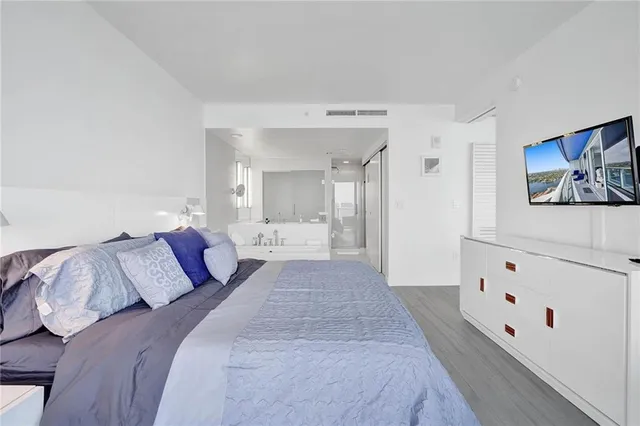 a bedroom with a bed and a cabinets