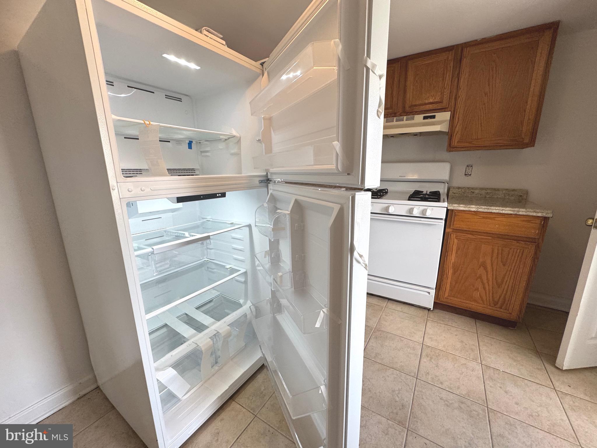 805 Brooks Lane, Unit 3 Baltimore, MD 21217 - Photo 8 of 9 a kitchen with stainless steel appliances cabinets and a counter top