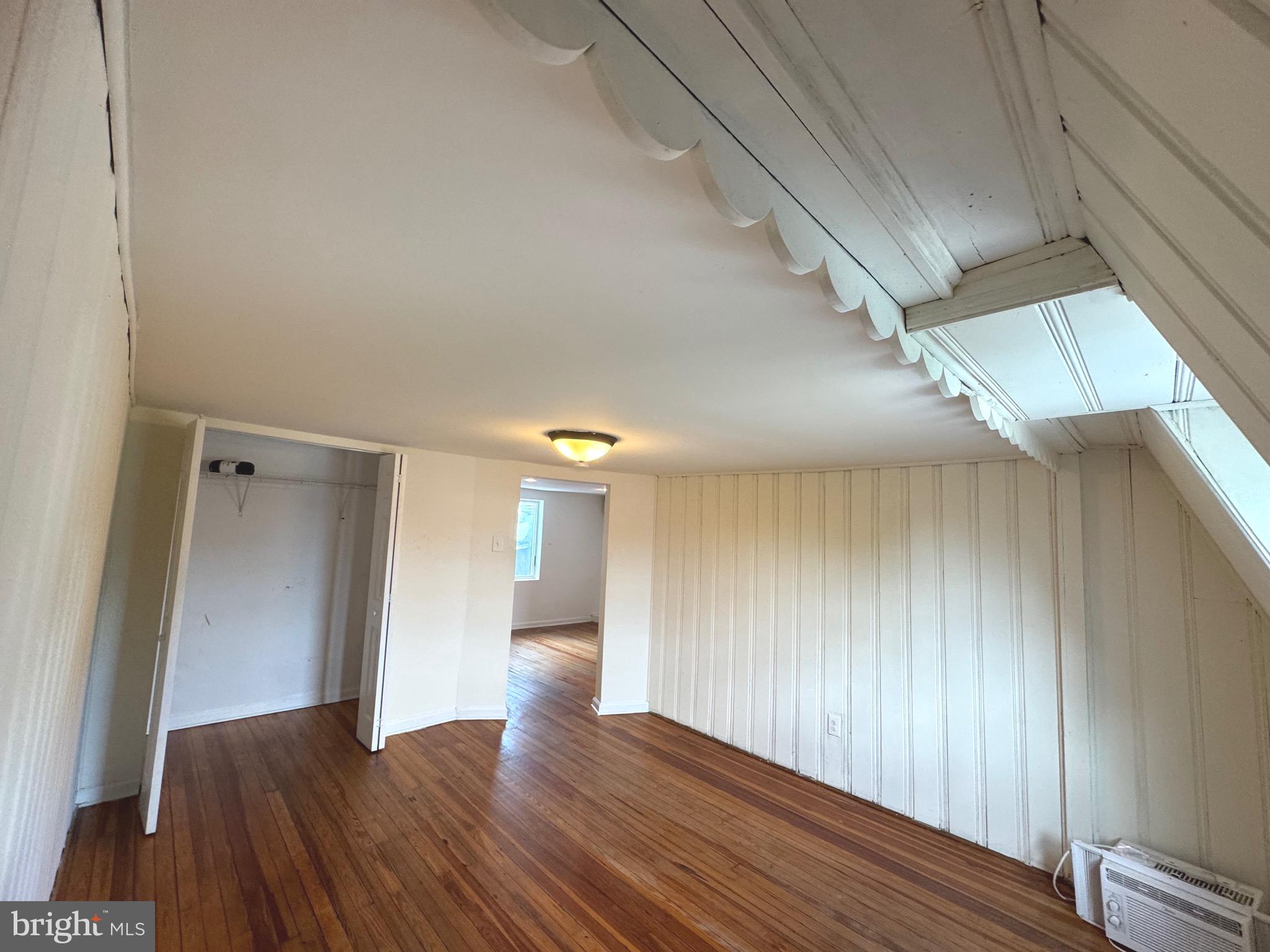 805 Brooks Lane, Unit 3 Baltimore, MD 21217 - Photo 9 of 9 a view of empty room with wooden floor