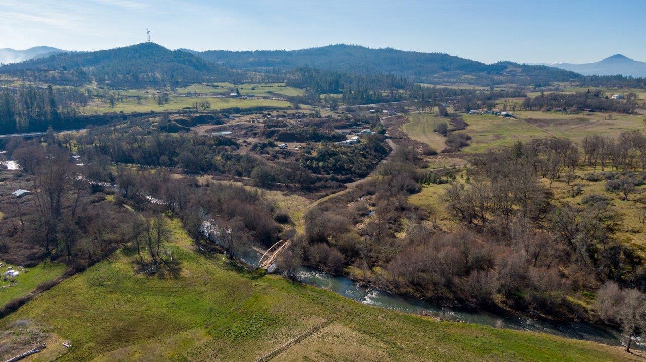 4684 Brownsboro-Meridian Road Eagle Point, OR 97524 - Photo 33 of 33 a view of a lush green hillside and houses