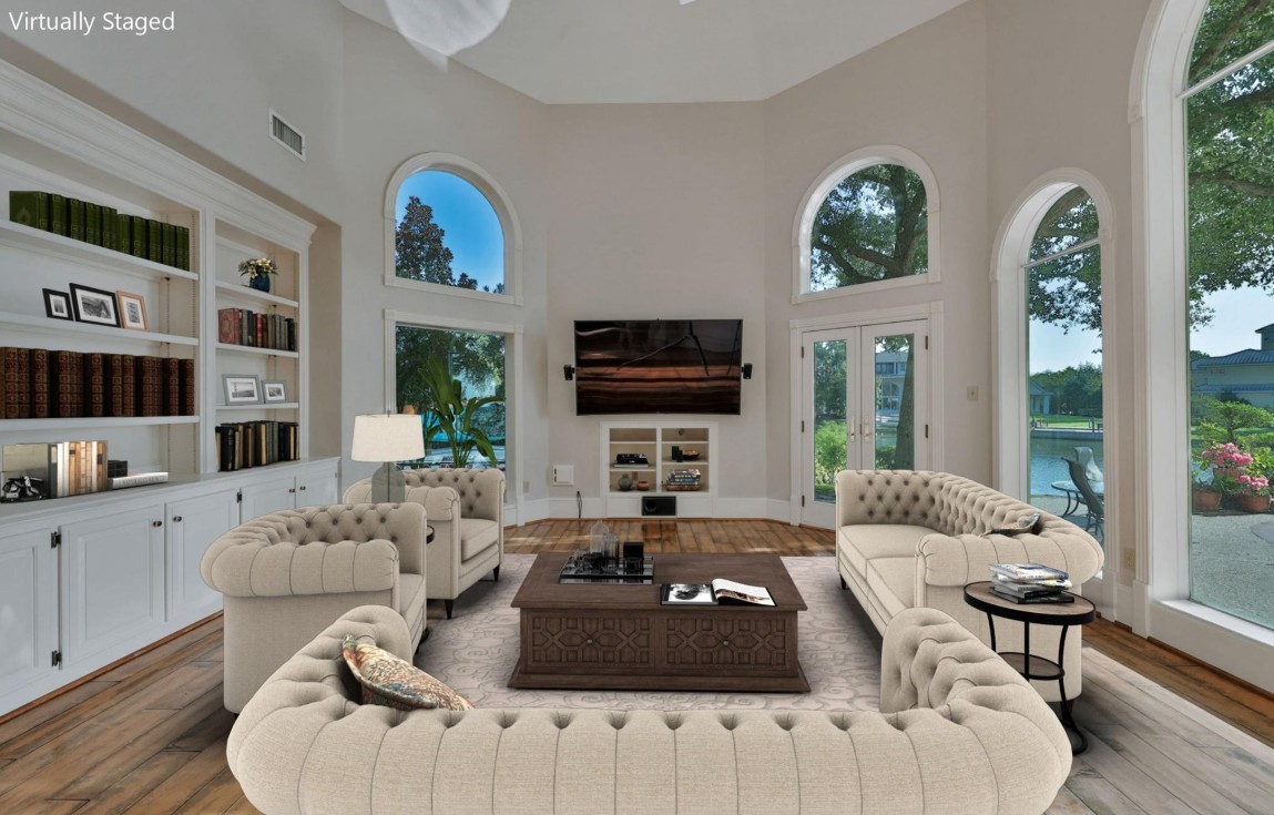 35 West Isle Place The Woodlands, TX 77381 - Photo 32 of 45 Spacious family room featuring floor-to-ceiling windows, and a cozy fireplace.