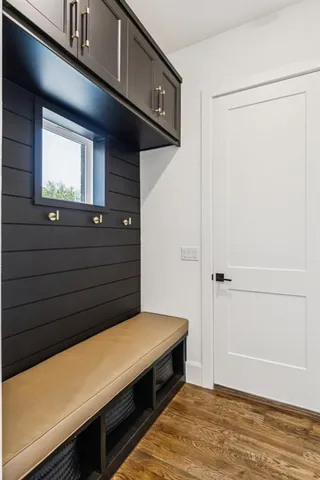 a living room with patio furniture and a large window