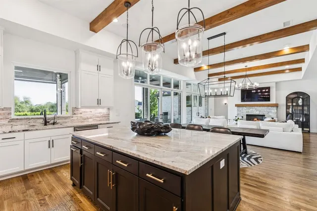 a kitchen with cabinets and stainless steel appliances