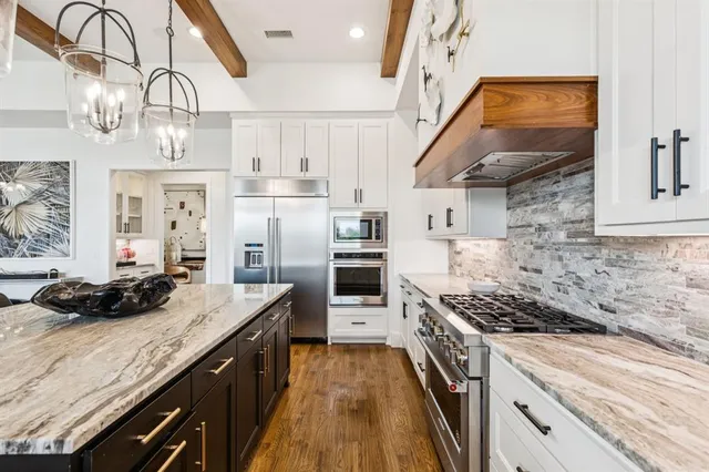 a bedroom with bed and a large window